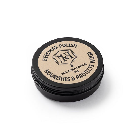 Natural beeswax wood polish in a black tin for wooden ring care by Forge and Lumber. Nourishes and protects wood.