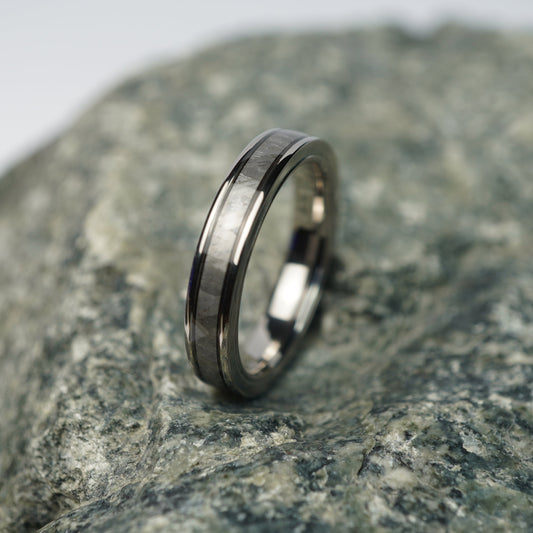 Aerospace-grade titanium 4mm wedding band with a brushed finish by Forge and Lumber.