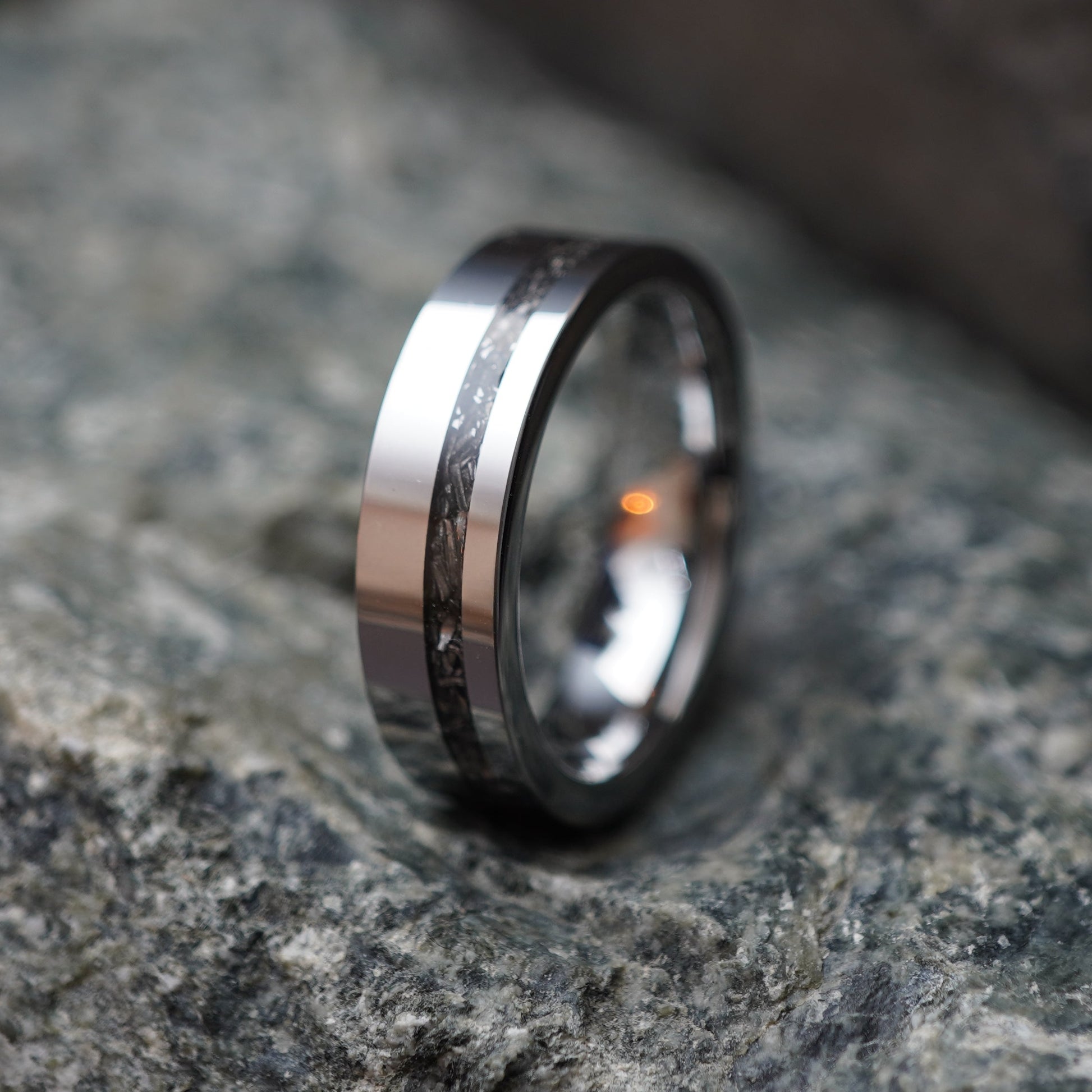 Men's 6mm stainless steel band ring with a textured black inlay by Forge and Lumber, ideal for anniversaries.