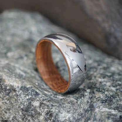 Damascus steel ring with a polished finish, featuring a wooden interior, by Forge and Lumber. Size UK M / US 6.