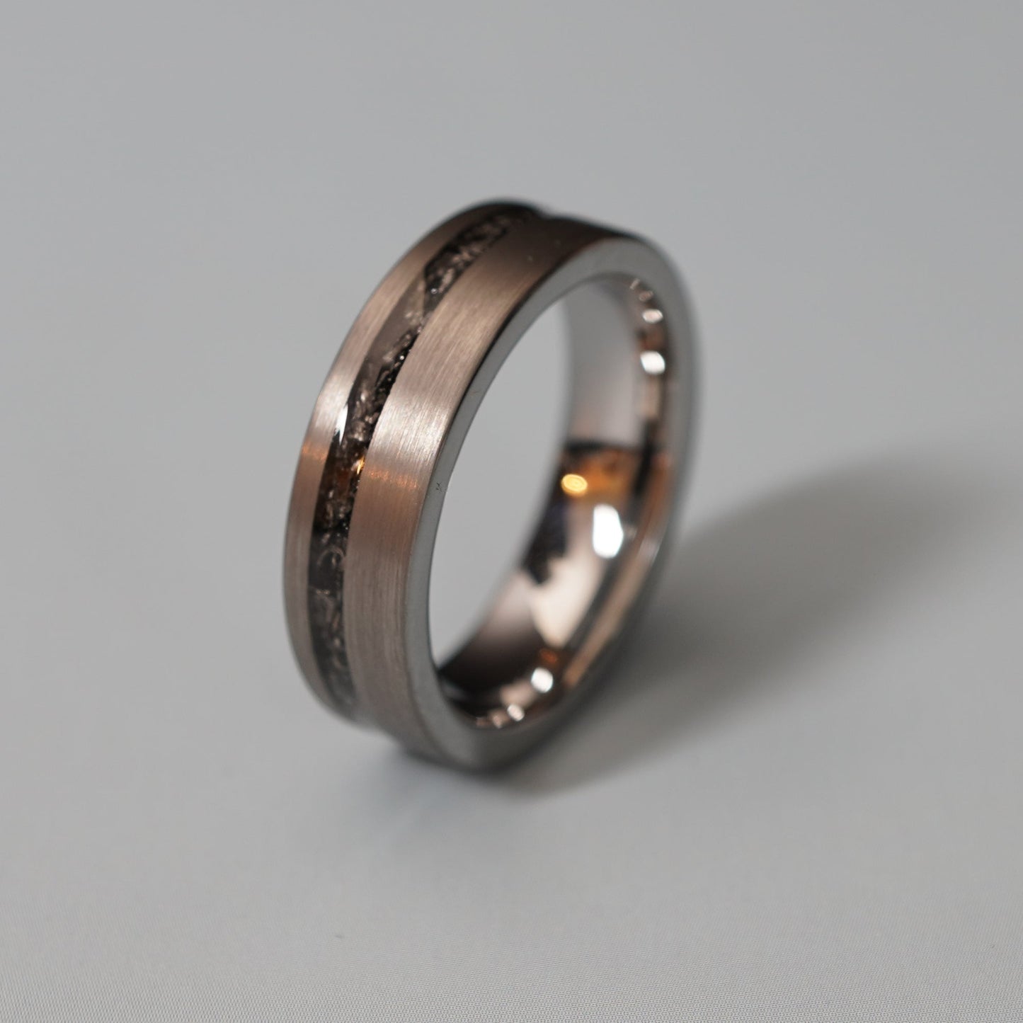 Brushed grey tungsten ring with a cosmic engravable center, by Forge and Lumber, available in 6mm sizes.