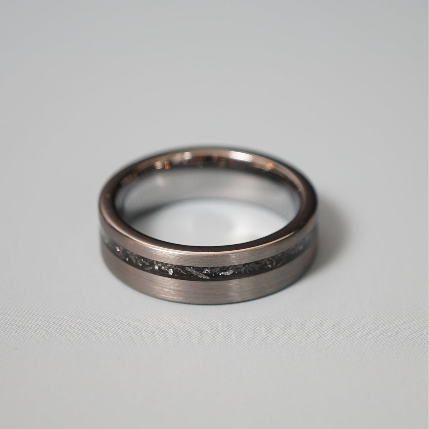 Engravable 6mm Nova ring by Forge and Lumber, featuring a sleek design with a cosmic inlay.