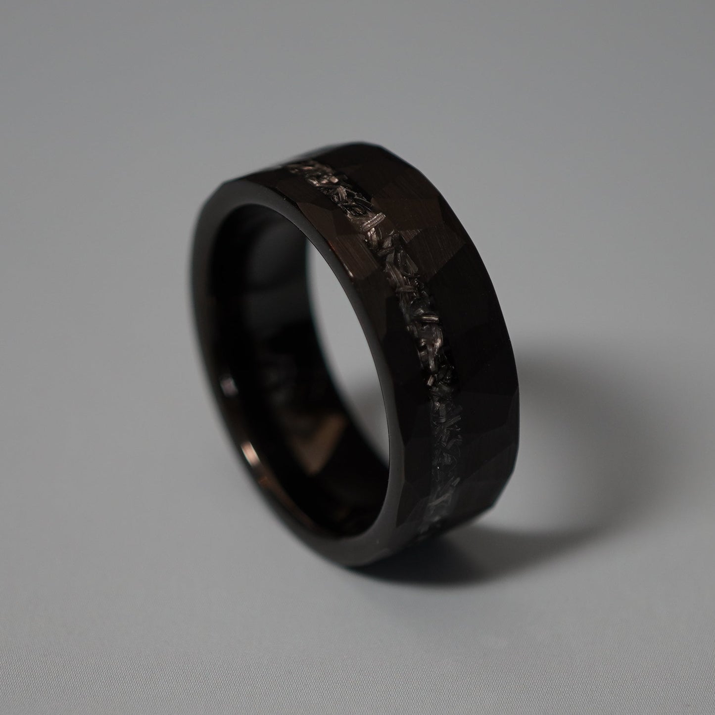 Black durable 8mm ring with a textured surface from Forge and Lumber. Available in multiple sizes.