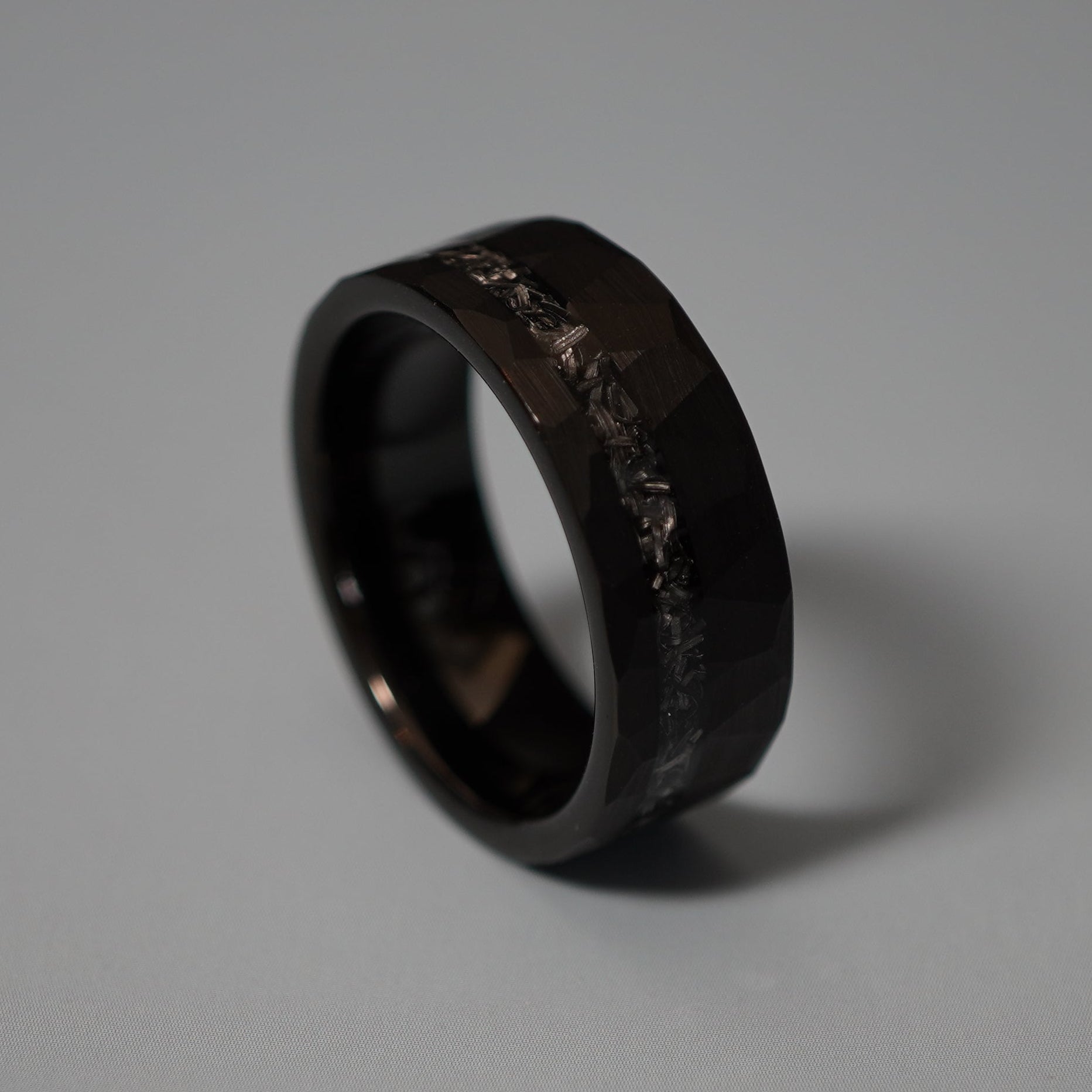 Black durable 8mm ring with a textured surface from Forge and Lumber. Available in multiple sizes.