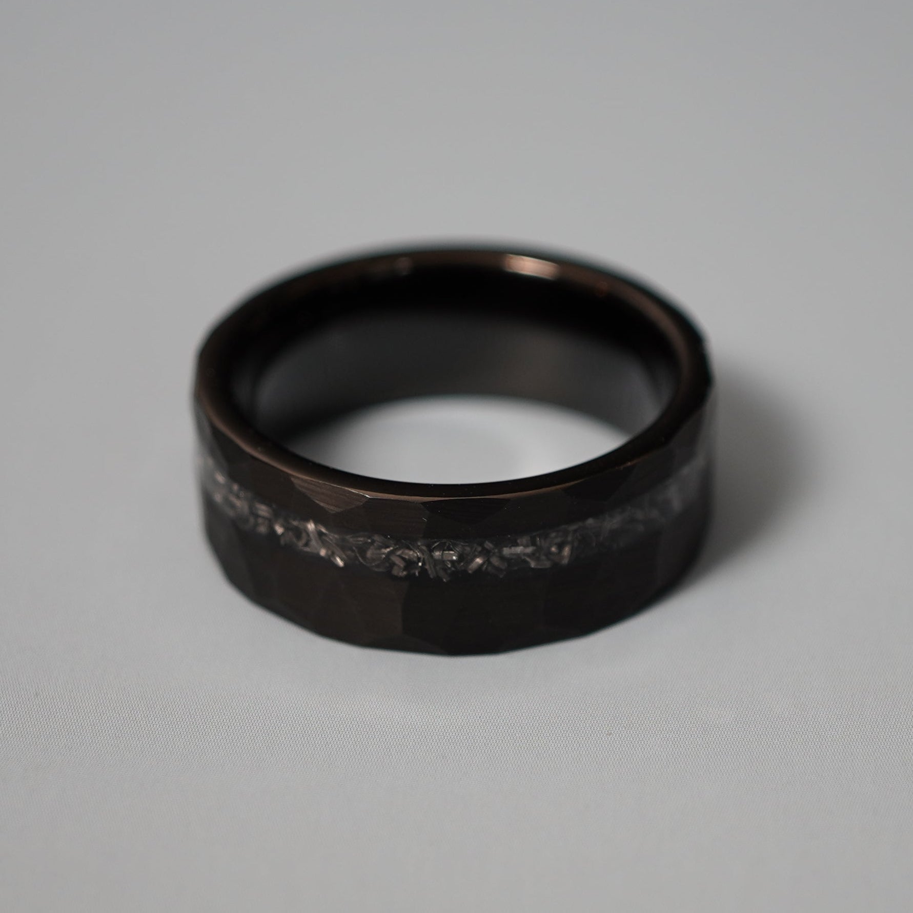 Black durable men's ring with a textured design and a clear inlay, by Forge and Lumber, available in sizes UK M to O.