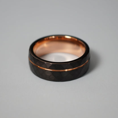 Black active lifestyle ring with 8mm width and rose gold accents by Forge and Lumber.