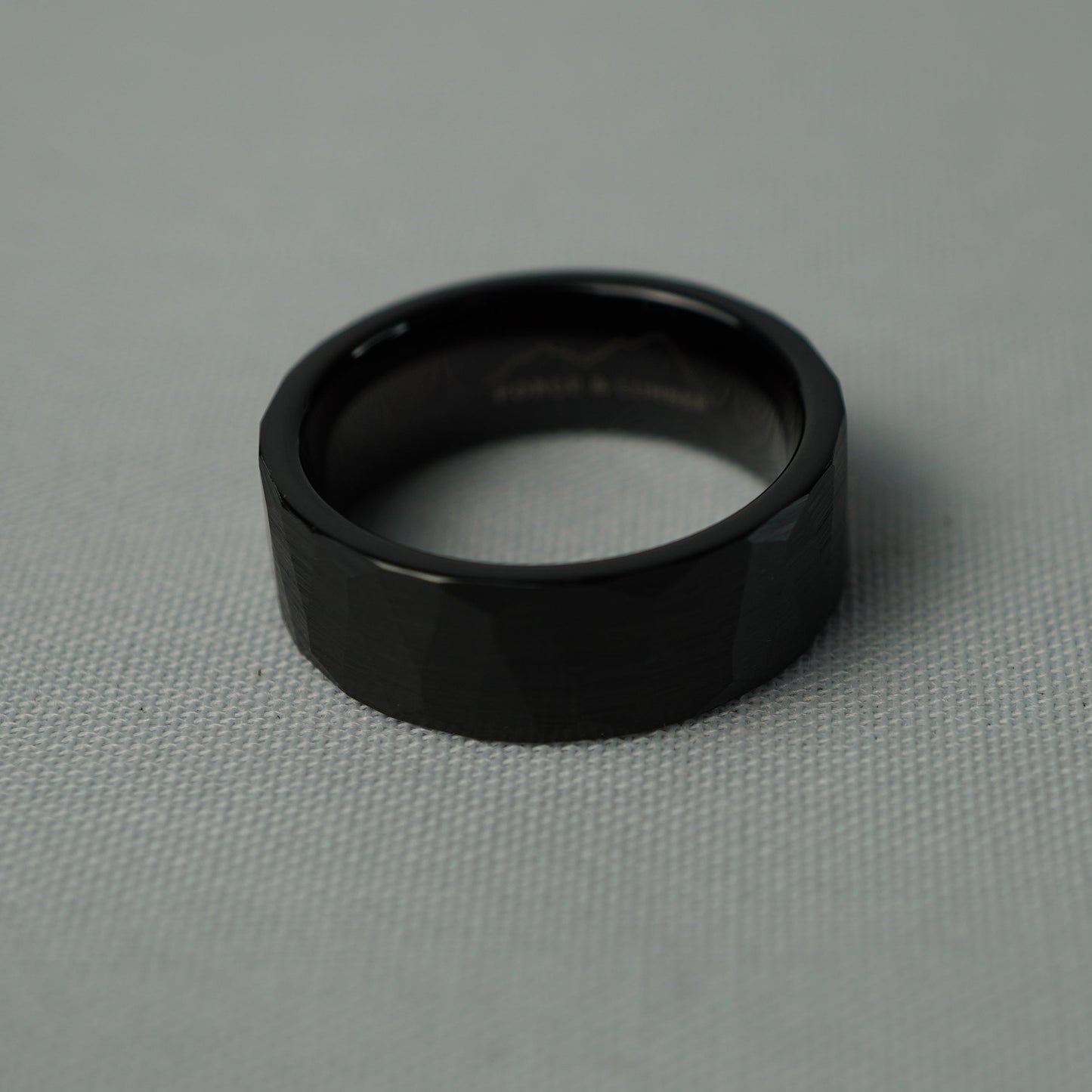 Black ring on a gray fabric background