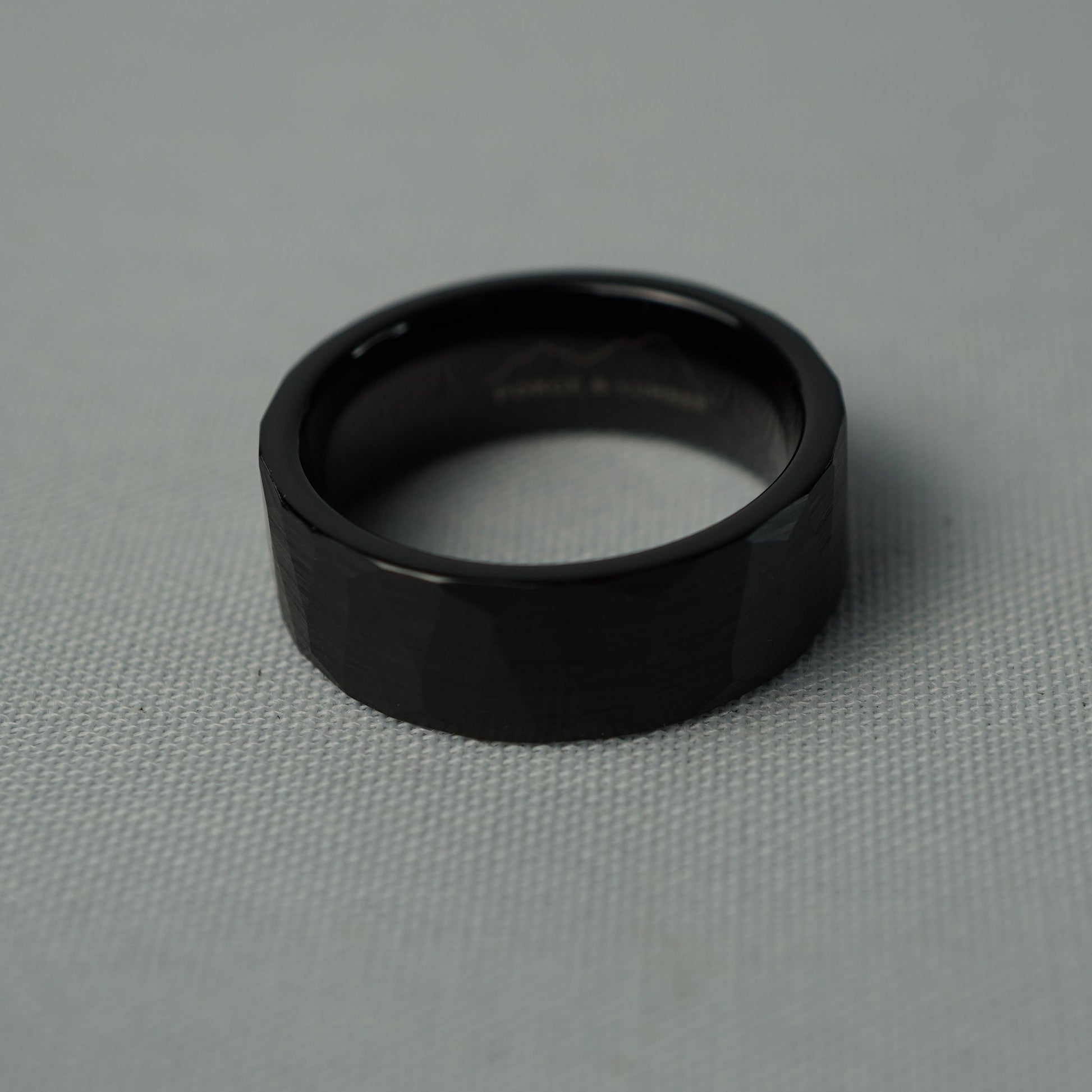 Black ring on a gray fabric background
