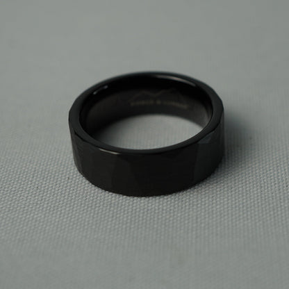 Black ring on a gray fabric background