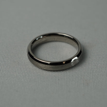 Silver ring on a gray textured surface