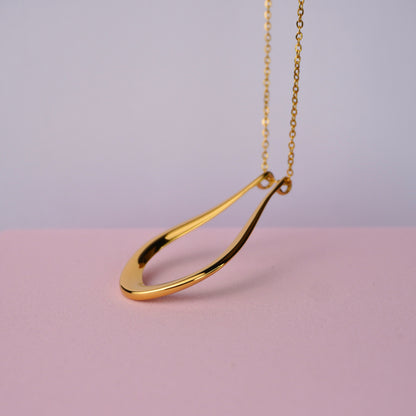 The Abalone ring holder necklace in gold, teardrop pendant