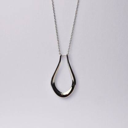 The Abalone ring holder necklace in gold with an adjustable chain