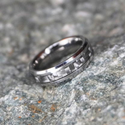Beveled silver ring with black inlay by Forge and Lumber, 6mm width, available in UK sizes K, L, and M.