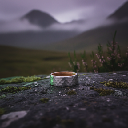 Textured silver and wood band ring by Forge and Lumber, showcasing a Celtic design inspired by Campbeltown.