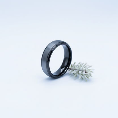 Beveled black tungsten ring from Forge and Lumber, available in sizes UK K, L, M.