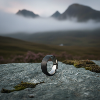 8mm black aerospace-grade carbon fiber ring by Forge and Lumber, with a sleek, modern design suitable for engravings.
