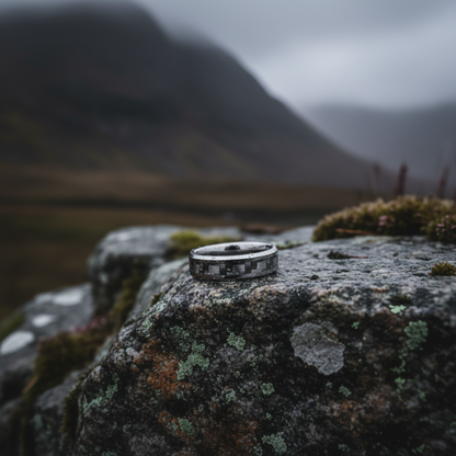 Beveled black inlay ring from Forge and Lumber, 6mm width, displayed on a rocky surface.